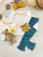 بلوز آستین بلند دخترانه سرشانه چیندار طرح گل آفتابگردون برند C&A