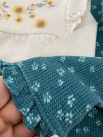 بلوز آستین بلند دخترانه سرشانه چیندار طرح گل آفتابگردون برند C&A - Image 8