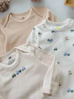 بادی نوزادی H&M آستین بلند کرم و بژ با طرح ماشین