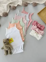 بادی بندی دخترانه نخی برند H&M در رنگ‌های پاستلی متنوع مناسب سیسمونی