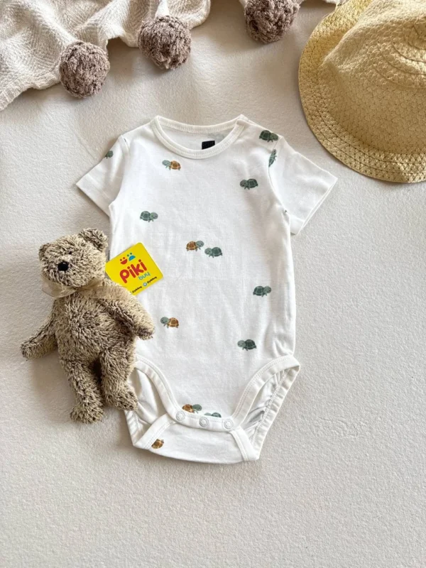 بادی آستین کوتاه برند H&M رنگ شیری با طرح لاک پشت 6تا9 ماه - Image 2