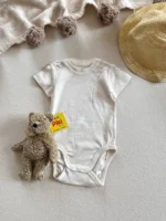 بادی آستین کوتاه برند H&M یقه گرد زمینه شیری 4-6 ماه